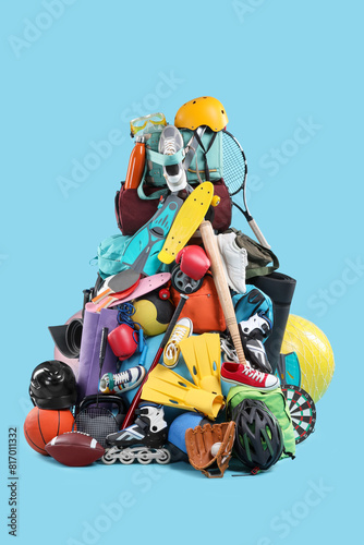 Many different sports equipment on light blue background