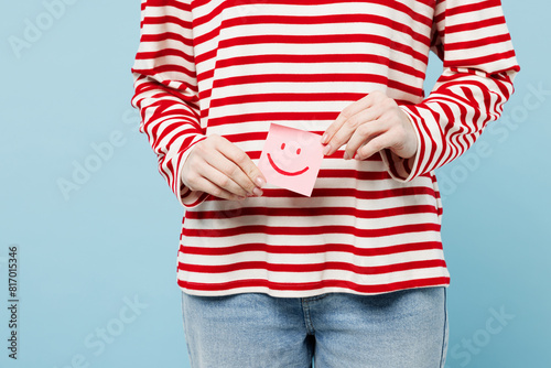 Close up cropped photo shot of young woman she wear red casual clothes hold card sign with happy smile symbol isolated on plain blue background. Medical gynecological, menstruation days oms concept. photo