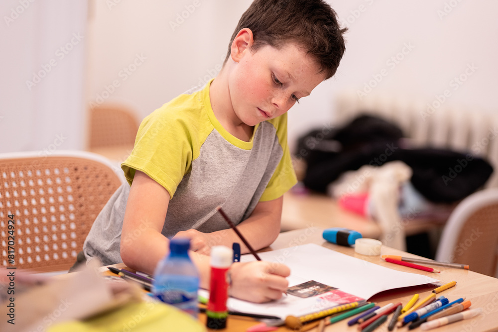 Boy focused on drawing at home Boy focused on drawing at home