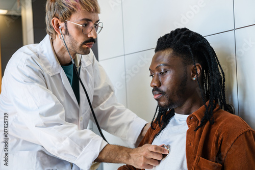 Doctor checking patient for signs of hypoglycemia photo