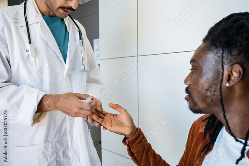 Doctor examining patient for hypoglycemia in clinic