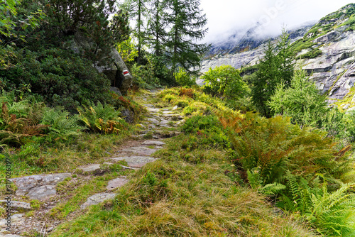 Scenic view of alpine landscape at hiking trail at Swiss mountain pass Grimsel on a cloudy late summer day. Photo taken September 19th, 2023, Grimsel, Canton Bern, Switzerland.