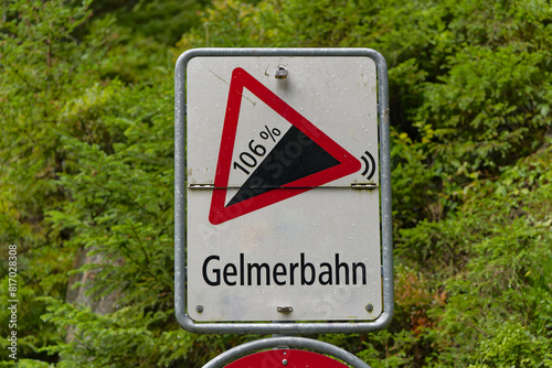 Traffic sign of funicular named Gelmerbahn with grade of 106 per cent on a cloudy late summer day. Photo taken September 19th, 2023, Handegg Guttannen, Switzerland. photo