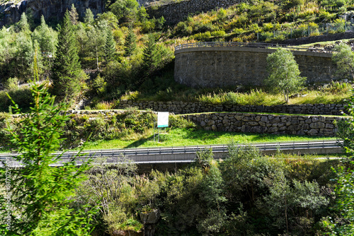 Wallpaper Mural Serpentine mountain pass road at famous Schöllenen Gorge at Swiss mountain village Göschenen on a sunny late summer day. Photo taken September 19th, 2023, Göschenen, Canton Uri, Switzerland. Torontodigital.ca