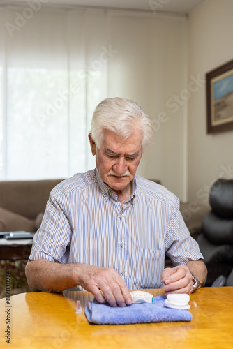 Elderly man checking blood sugar level for hypoglycemia