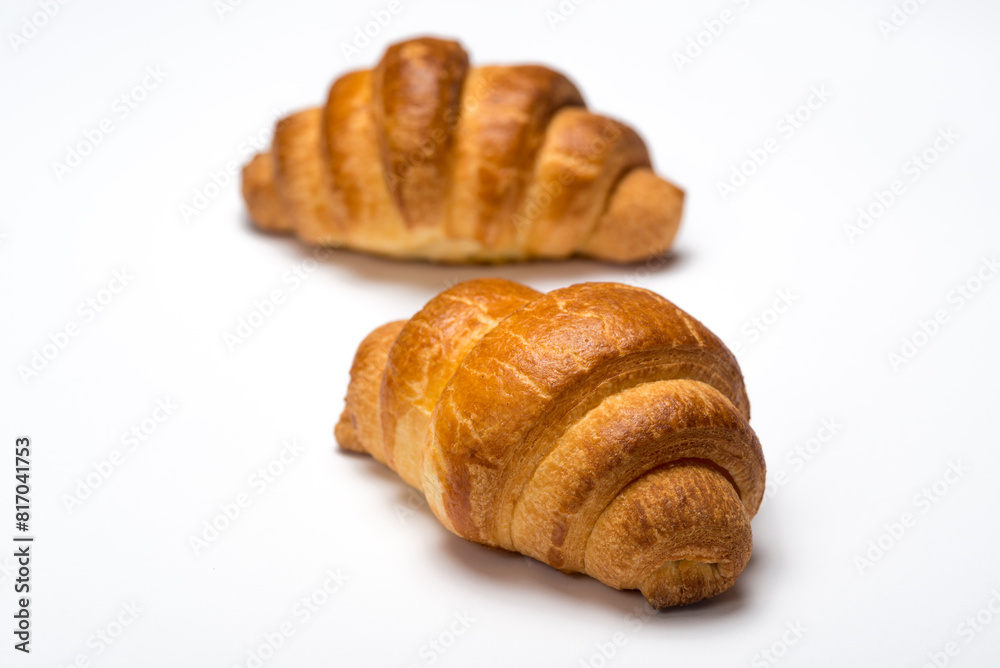 two fresh croissants on white background two fresh croissants on white background