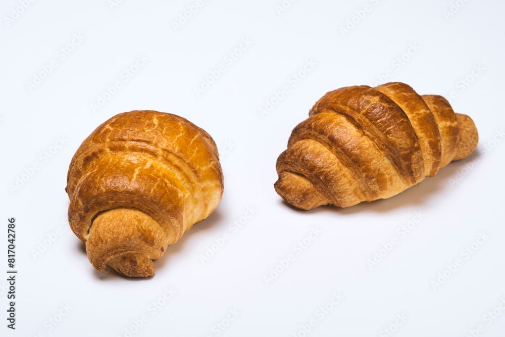 two fresh croissants on white background two fresh croissants on white background