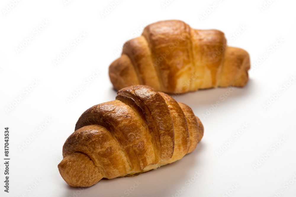 two fresh croissants on white background two fresh croissants on white background