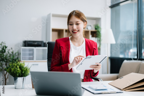 Free Download Asian businesswoman working with working notepad, tablet and laptop documents  in the office - GFXLoad