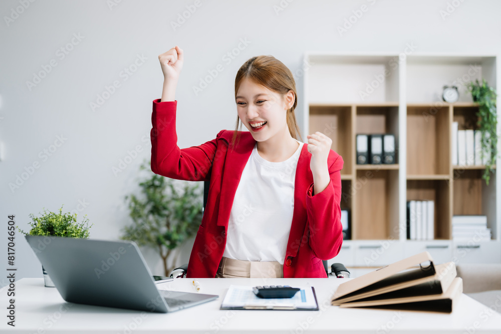 Business woman are delighted and happy with the work they do on their tablet, laptop at office... Business woman are delighted and happy with the work they do on their tablet, laptop at office...