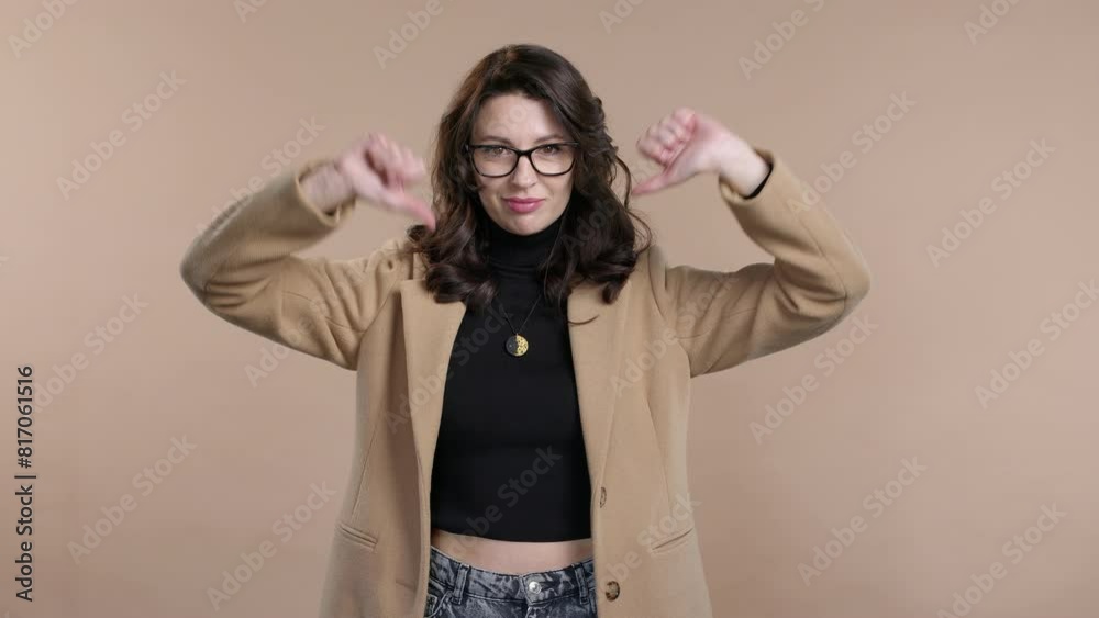 Business woman with sign of dislike. Mature pretty lady showing thumbs-down Business woman with sign of dislike. Mature pretty lady showing thumbs-down
