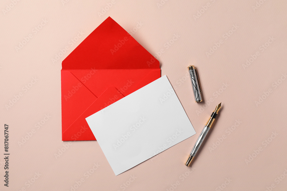 Blank sheet of paper, letter envelope and pen on beige background, top view. Space for text Blank sheet of paper, letter envelope and pen on beige background, top view. Space for text