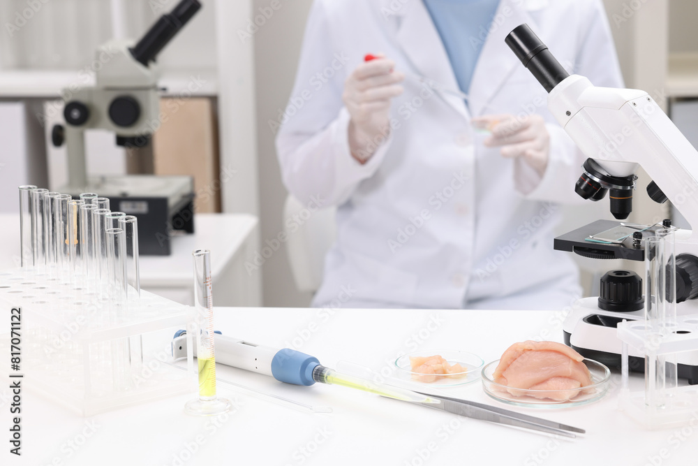 Quality control. Food inspector examining meat in laboratory, closeup Quality control. Food inspector examining meat in laboratory, closeup