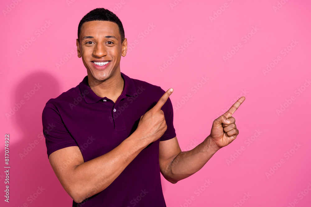 Photo portrait of nice young male point empty space dressed stylish violet garment isolated on pink color background Photo portrait of nice young male point empty space dressed stylish violet garment isolated on pink color background