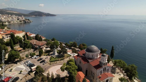 A mesmerizing aerial journey unveils the harmonious dance between a bustling city and the tranquil sea, capturing the vibrant architecture, sandy beaches, and shimmering waters below