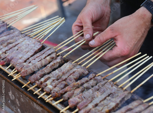 Arrosticini are a class of traditional dishes of skewered grilled meat typical of Abbruzzo and Molise regions in Italy photo