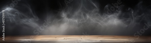 Dark abstract wooden table top with a smoky atmosphere photo