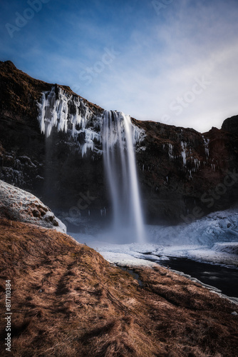 Snowy waterfall with ice