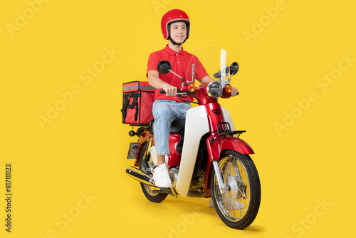 Delivery man on red motorcycle with insulated backpack © Naypong Studio