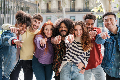 Group of young people of diverse origins pointing at the camera and aiming to improve. together