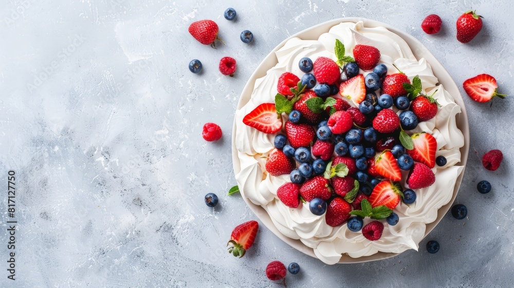 Top view of Australian pavlova with berries, using the rule of thirds, with ample copy space Top view of Australian pavlova with berries, using the rule of thirds, with ample copy space