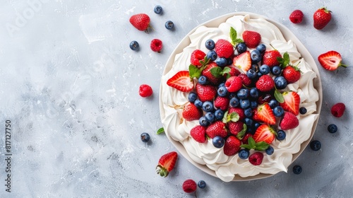 Top view of Australian pavlova with berries, using the rule of thirds, with ample copy space