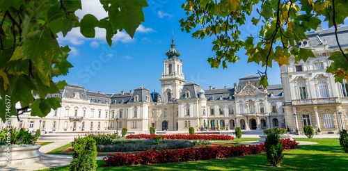 Beautiful baroque Festetics Castle in Keszthely Hungary with flowers in the park © Bernadett