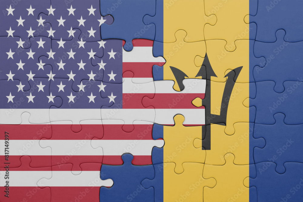 Obraz premium puzzle with the colourful national flag of barbados and flag of united states of america .