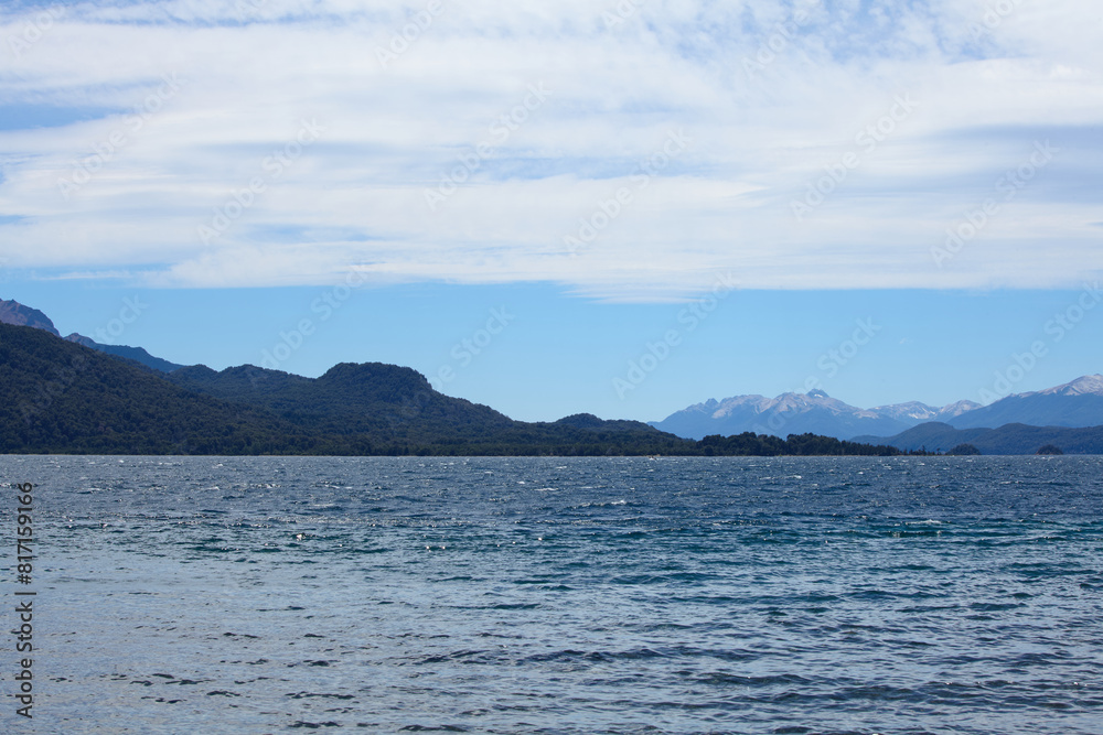 blue lake against the backdrop of rocky mountains