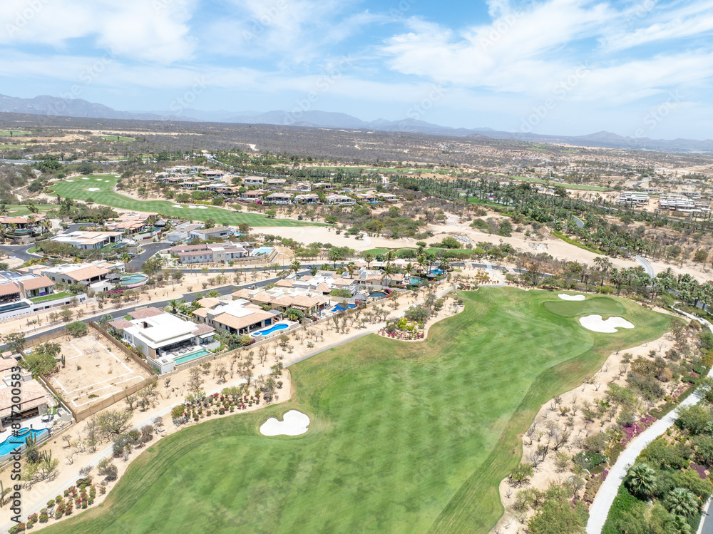 Fototapeta premium Aerial view of luxury golf course on the pacific ocean in Los Cabos, Cabo San Jose, Mexico