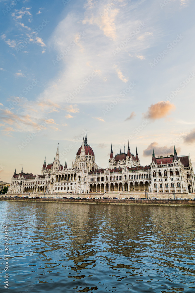 Hungarian parliament building with sunset sky by Danube river, Budapest, Hungary