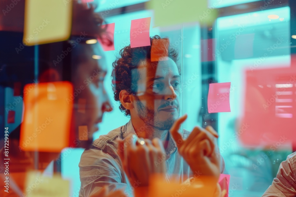 Creative Agency Brainstorming Session with Sticky Notes on Glass Walls, Diverse Team Members Discussing Ideas Creative Agency Brainstorming Session with Sticky Notes on Glass Walls, Diverse Team Members Discussing Ideas