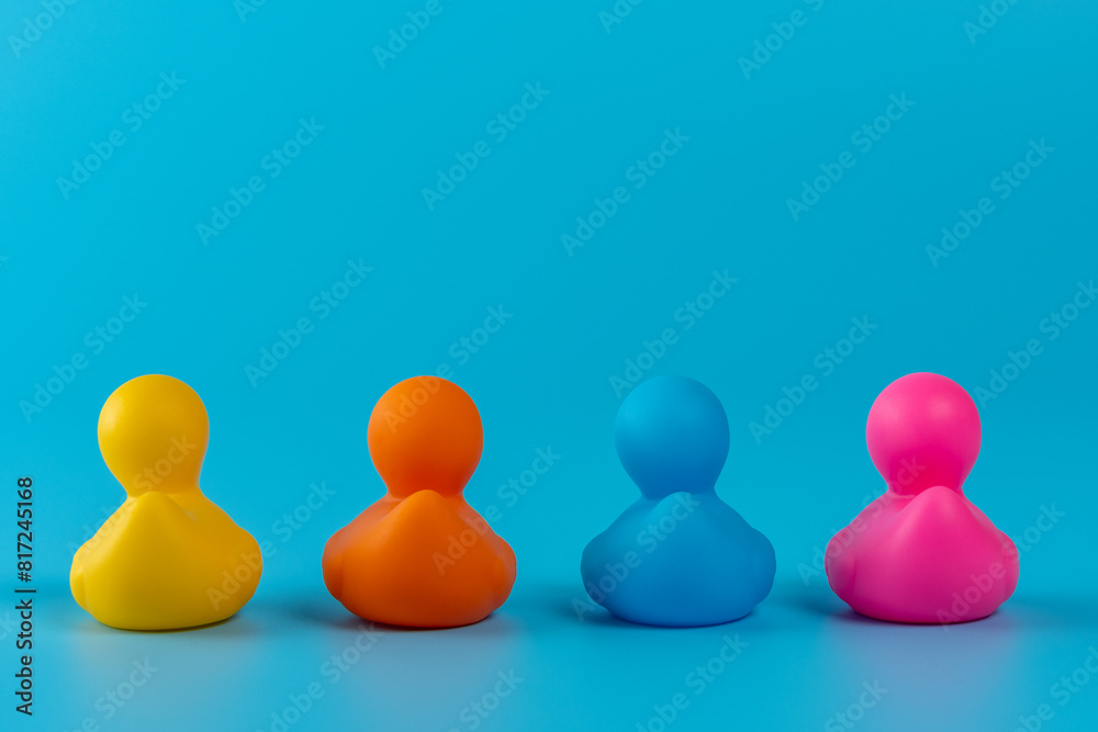 Colorful rubber ducks on blue background. Summer minimal concept. Colorful rubber ducks on blue background. Summer minimal concept.