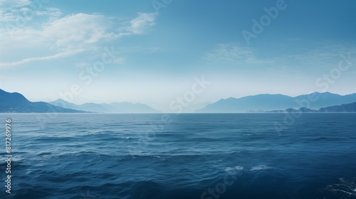 Stunning Ocean View with Distant Mountains Under Calm Sky