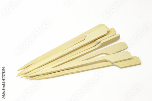Pile of sharp bamboo sticks isolated on white background. Wooden cocktail and snack sticks
