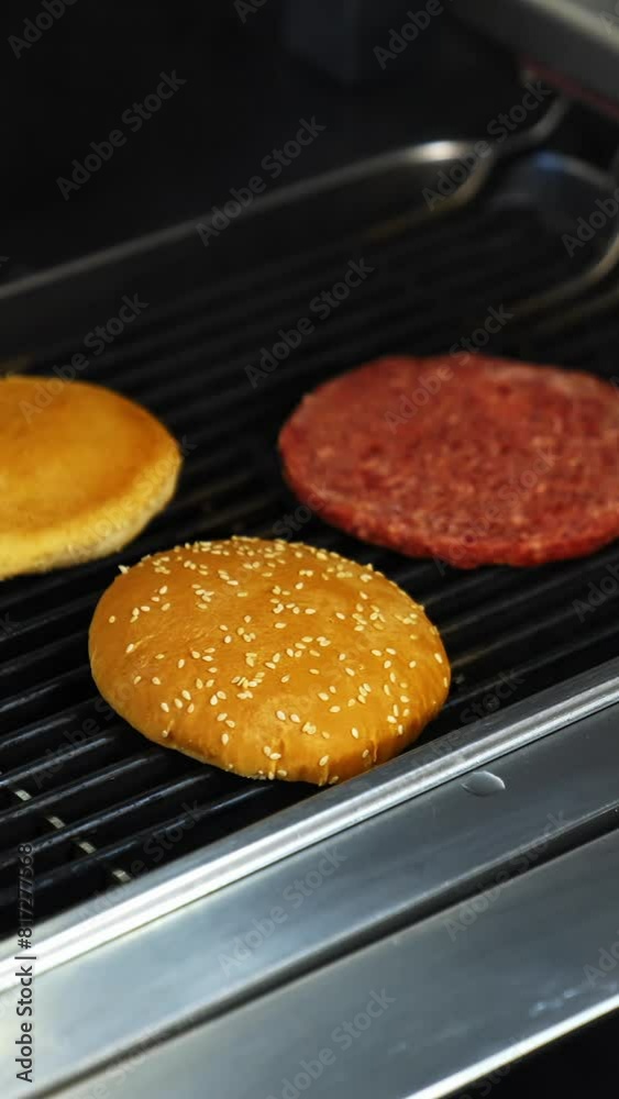 Cooking beef and pork patty for burger. Meat roasted at kitchen. Slow motion. Vertical video Cooking beef and pork patty for burger. Meat roasted at kitchen. Slow motion. Vertical video