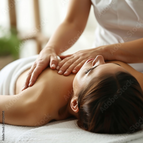 Close-up of a young woman having a massage in a spa.