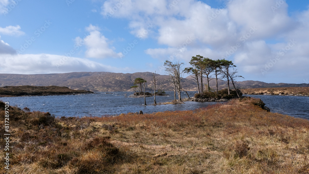 Stunning rugged and mountainous landscape with Lewisian gneiss precambrian metamorphic rock on Loch Inver, Assynt district of Sutherland in the highlands of Scotland UK Stunning rugged and mountainous landscape with Lewisian gneiss precambrian metamorphic rock on Loch Inver, Assynt district of Sutherland in the highlands of Scotland UK