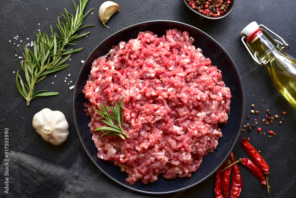 Homemade minced meat with ingredients for making in a bowl . Top view. Homemade minced meat with ingredients for making in a bowl . Top view.