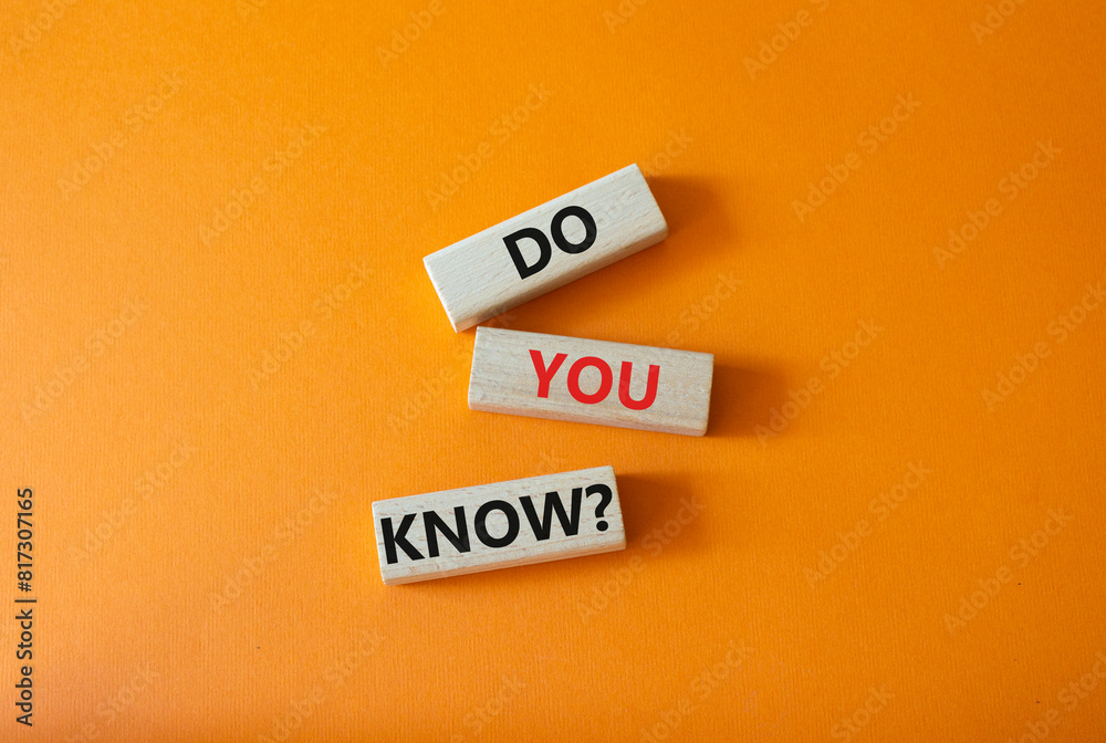Do you know symbol. Concept word Do you know on wooden cubes. Beautiful orange background. Business and Do you know concept. Copy space. Do you know symbol. Concept word Do you know on wooden cubes. Beautiful orange background. Business and Do you know concept. Copy space.