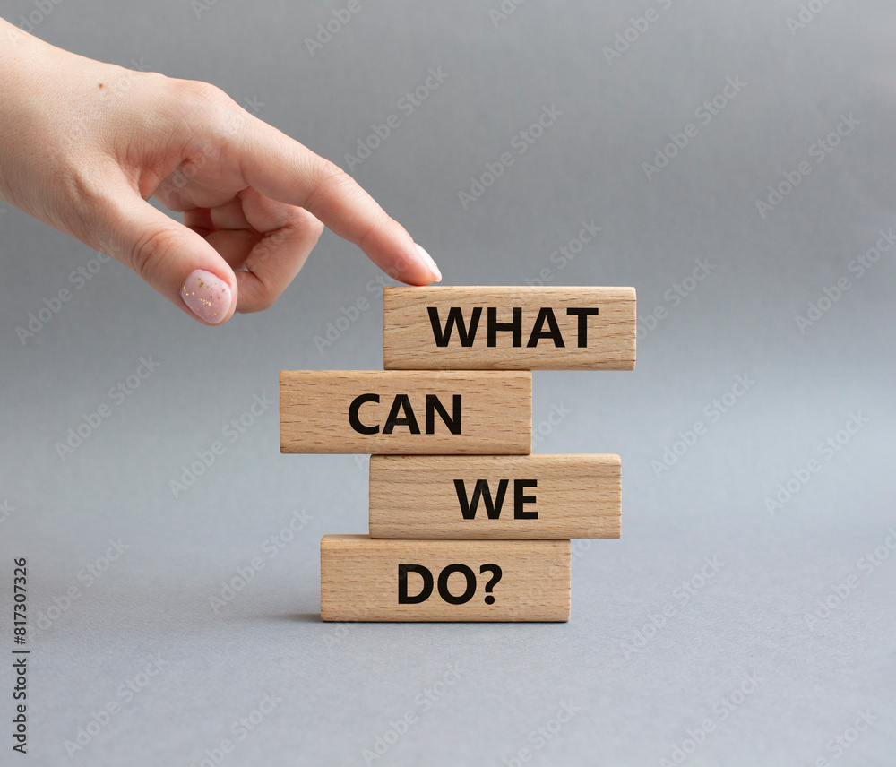What can we do symbol. Wooden blocks with words What can we do. Businessman hand. Beautiful grey background. Business and What can we do concept. Copy space. What can we do symbol. Wooden blocks with words What can we do. Businessman hand. Beautiful grey background. Business and What can we do concept. Copy space.