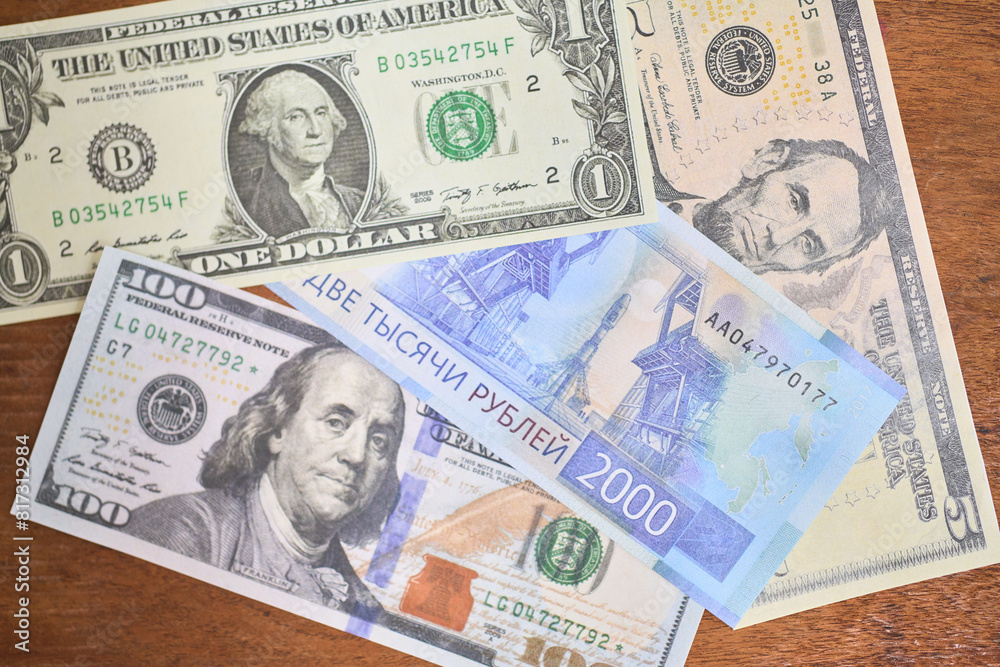 Comparison of dollar bill with russian rouble, concept of inflation or abundance Comparison of dollar bill with russian rouble, concept of inflation or abundance