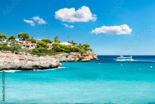 Mediterranean rocky coast with ferry boat in the southeast of Mallorca - 7681