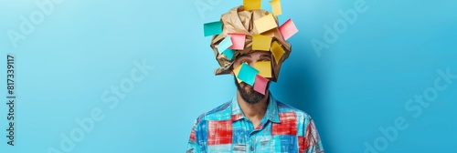 Creative concept of a person with a head replaced by crumpled paper and sticky notes on blue background
