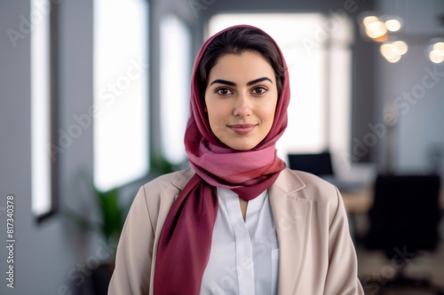 close-up portrait of a confident young middle eastern woman at office