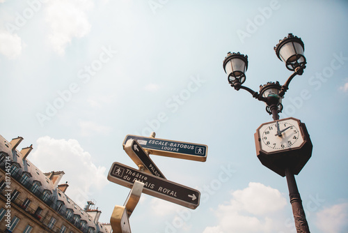 Looking Up at the street signs in Paris, France on a Sunny Day 