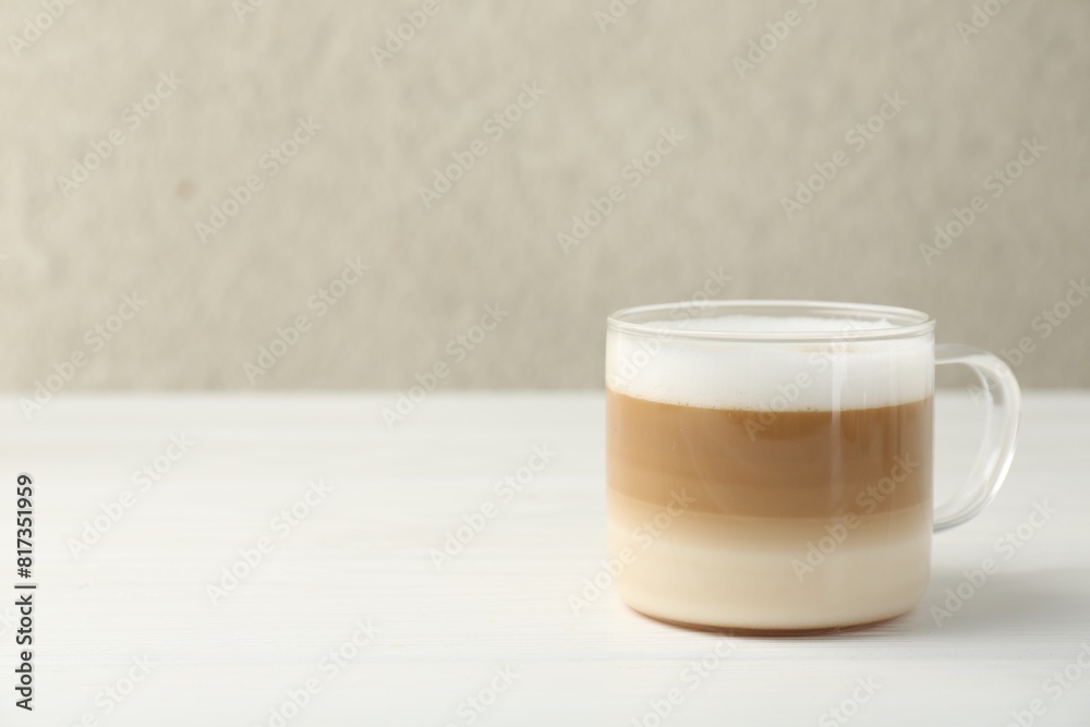 Aromatic coffee in glass cup on white wooden table, space for text Aromatic coffee in glass cup on white wooden table, space for text