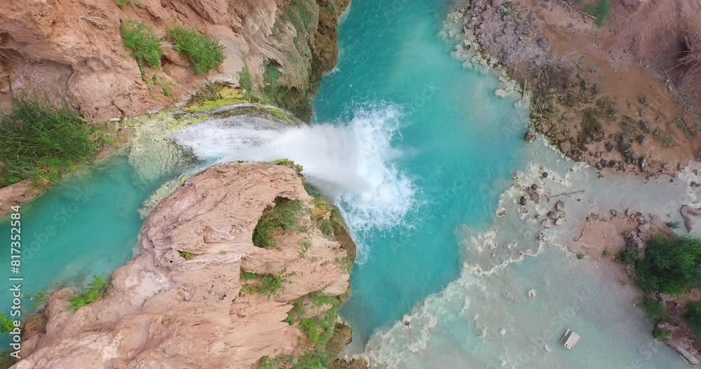 Majestic high shot over waterfall and blue pond Majestic high shot over waterfall and blue pond