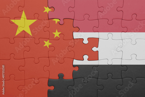 puzzle with the colourful national flag of yemen and flag of china .