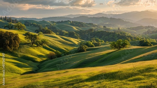 Rolling hillsides bathed in the soft light of evening  where the colors of sunset blend with the verdant landscape in a tranquil scene.